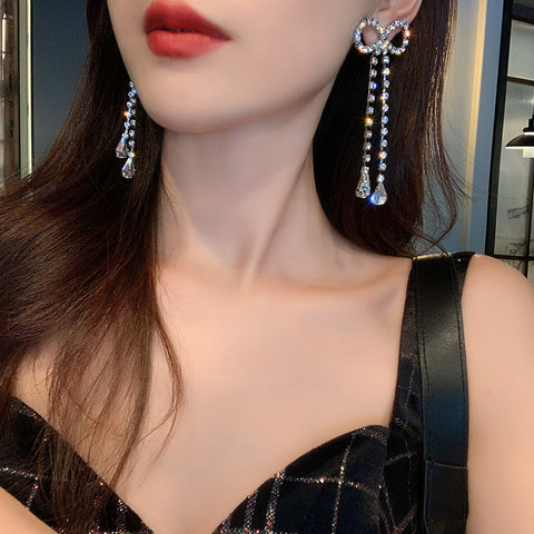 Arzonai 925 silver needle atmosphere super fairy full diamond bow goddess earrings Korean temperament net red exaggerated ear jewelry wholesale