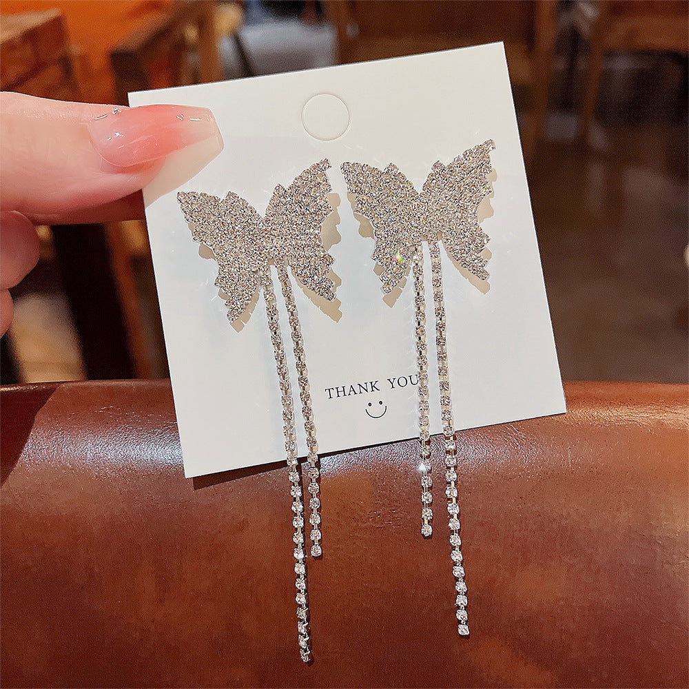 Arzonai South Korea's Dongdaemun full diamond butterfly tassel temperament fashion long earrings 925 silver needle super flash earrings female earrings