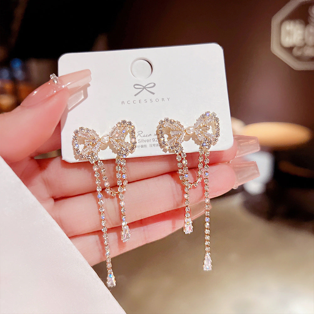 Arzonai Korean temperament bow earrings tassel autumn and winter earrings long pearl design earrings 925 silver needle wholesale