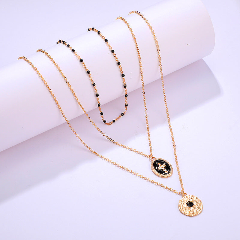 Arzonai European and American cross-border new jewelry fashion simple geometric alloy black dripping round cross multi-layer necklace