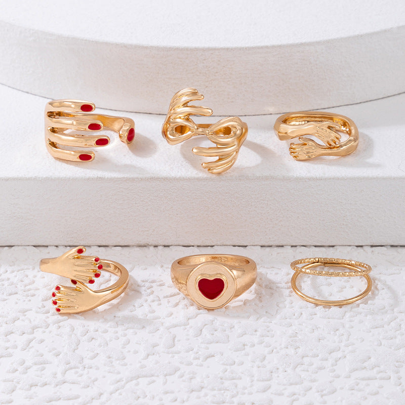 Arzonai European and American cross-border Hug Me Golden jewelry red dripping hand six-piece ring love geometric open ring set