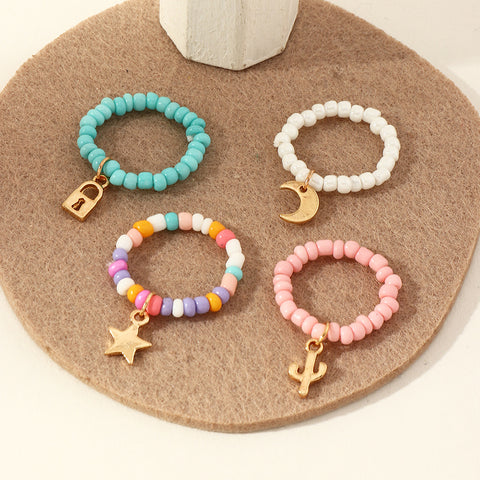 Arzonai Multicolored Beads Rice Beads Adjustable Fun Ring Female Star Moon Pendant Ring Set of 4 Pcs