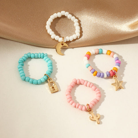 Arzonai Multicolored Beads Rice Beads Adjustable Fun Ring Female Star Moon Pendant Ring Set of 4 Pcs